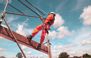 construction worker on safety harness, safety impacts the labor shortage