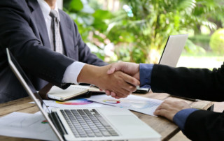Shaking hands; Hiring manager working with a recruiter to hire the best construction candidate.